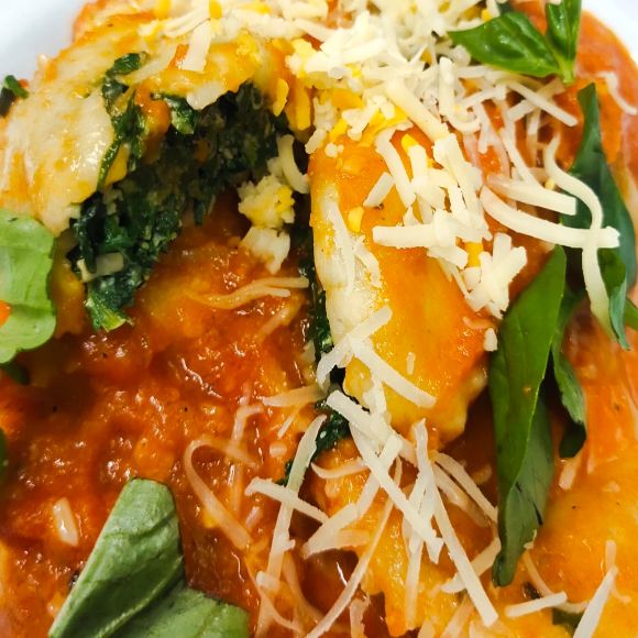 Spinach And Ricotta Cheese Ravioli in Basil infused Pomodoro sauce